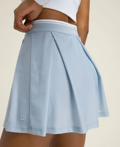 Breeze Lined Tennis Skirt | Wilson Sporting Goods Sporty Pleated Tennis Dress For Summer, Sporty Relaxed Pleated Skirt, Sporty Relaxed Fit Lined Pleated Skirt, Sporty Pleated Skirt With Lining, Casual Pleated Tiered Tennis Skirt, Sporty Pleated Tennis Skirt For Summer, Pleated Tiered Relaxed Tennis Skirt, Sporty Summer Tennis Skirt With Pleated Waist, Tiered Pleated Tennis Skirt