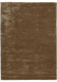 a brown rug with an uneven design on the top and bottom corner, in front of a white background