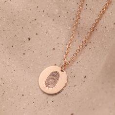 The Chiara necklace is a light gold round disc necklace that you just NEED. Whether you wear it alone or stacked, with your another necklace or bare alone- it's perfect. Add a personal touch to your Chiara necklace with an engraved fingerprint of a loved one. If you can dream it- we can make it happen. Chain Length: Length: 42cm/16" (extension: 3cm/1.8") Total 45cm/18" Element: Size: 10mm All features can be customized! Talk to us, we love making custom designs. Our jewelry is carefully handmade in our atelier Elegant 14k Gold Hand Stamped Necklaces, Elegant 14k Gold Necklace With Hand Stamped Details, Elegant 14k Gold Necklace Hand Stamped, Dainty Engraved Round Pendant Coin Necklace, Minimalist Engraved Yellow Gold Coin Necklace, Minimalist Yellow Gold Hand Stamped Necklace, Minimalist Engraved Round Pendant Jewelry, Minimalist Hand Stamped Yellow Gold Necklace, Minimalist Engraved Medallion Charm Necklace