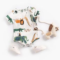 Keep your little one stylish and comfy in this adorable Baby Cartoon Bodysuit. Crafted with soft and breathable fabrics, it's a must-have for your child's wardrobe. With its vibrant designs, it will add a splash of color to any outfit! Introducing Lenny Lemons Baby Cartoon Bodysuit, the ideal choice for sunny adventures. Adorned with adorable cartoon prints, these bodysuits bring a smile to your baby girl's face. Crafted from breathable cotton, these short-sleeved bodysuits keep your baby comfy Cute Cartoon Print Jumpsuits And Rompers For Playtime, Spring Cartoon Print Onesie For Playwear, Spring Onesie With Cartoon Print For Playwear, Cute Cartoon Print Bubble Romper For Playtime, Green Playful Bodysuit For Playtime, Playful White Bubble Romper With Cartoon Print, Cute Bubble Romper With Cartoon Print For Playtime, Cute Printed Jumpsuits And Rompers For Playwear, Casual Printed Fitted Short Sleeve Bodysuit