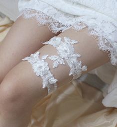 "Gorgeous white lace garter set - rhinestone, silver beads and sequin are embroidered on the lace, match the stretchy organza band for comfortable fit. This gorgeous and glittering garter set will make your special day shine even brighter. * Set of garter (Keepsake and toss garter ) * Keepsake garter lace measured approximately 6\" X 2.5\" * Toss garter lace measured approximately 3.5\" x 1.5\" * Stretch organdy band - white, ivory and light blue * Comes with a pink box. CUSTOM ORDER Please choo Fitted Lace Bridal Belt For Ceremony, Fitted Lace Bridal Belt For Bride, Fitted Lace Bridal Accessories For Bride, White Beaded Lace Bridal Accessories, White Fitted Bridal Belt For Ceremony, Fitted White Lace Bridal Belt, White Fitted Lace Bridal Belt, White Lace Embellished Bridal Accessories, Embellished White Lace Bridal Belt