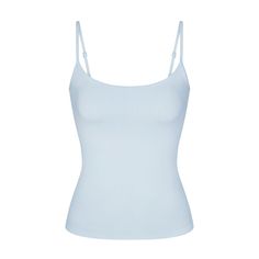 Getting dressed is smoother in SKIMS. Made with our buttery-sleek fabric that smooths and hugs your body, this lightly supportive tank flatters your figure and levels up your off-duty comfort. Features a shelf bra with underbust elastic for light bust support, a scoop neck, and adjustable straps. Hits below the natural waist. Fits true to size. Viral Clothes 2024, Cute Clothing Pieces, Cute Blue Tops, Light Blue Spaghetti Strap Top, Fitted Light Blue Cami Top, Fitted Light Blue Camisole, Stockholm Clothes, Kyanite Skims, Blue Seamless Camisole