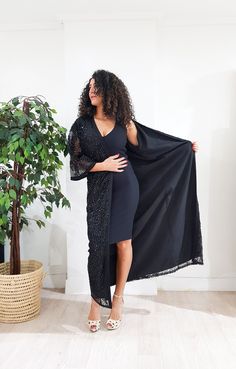 Jaw dropping piece. The Arabella kimono features a maxi silhouette, ornate sequin embellishment throughout, and finished with handmade black silk trimming for a luxurious look. Let's get this party started. Only one available DETAILS Lace embellished with sequins Handmade silk Sfifa Trimmings Fully Lined Black Maxi Length 1.40 meter /55 inch One size fits all Dry clean only Handmade in Morocco Got a question!! don't hesitate to contact me :) Chic Long Kaftan For Evening, Chic Long Evening Kaftan, Elegant Embellished Maxi Dress With Cape Sleeves, Elegant Summer Party Kaftan, Bohemian Cape Sleeve Dresses For Eid, Bohemian Dress With Cape Sleeves For Eid, Chic Evening Maxi Kaftan, Embellished Maxi Dress With Cape Sleeves For Party, Embellished Maxi Dress For Night Out