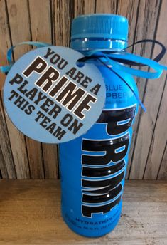 a blue water bottle with a label that says you are a prime player on this team