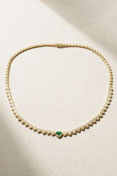 Anita Ko designs elegant jewelry that's as suited for special events as everyday wear. This heart-strung necklace is cast from 18-karat gold traced with twinkling diamonds and a heart-cut emerald that takes center stage. Wear yours alone with an off-the-shoulder neckline to let it truly dazzle. Luxury Heart-shaped Diamond Necklace With 17 Jewels, Elegant Hand-set Emerald Necklace In Yellow Gold, Elegant Yellow Gold Hand Set Emerald Necklace, Elegant Heart-shaped Tennis Necklace, Elegant Yellow Gold Emerald Necklace With Diamond Accents, Elegant Heart Pendant Emerald Necklace As Gift, Elegant Heart Pendant Emerald Necklace, Elegant Heart Pendant Emerald Necklace For Gift, Elegant Emerald Heart Pendant Necklace As Gift