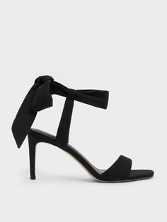 To add feminine flair to your outfits, these sandals will do the job. The open-toed style is elegant in its minimal appeal, especially when paired with dainty tie-around ankle straps. They will accentuate your ankles and ensure a secure fit at the same time. With its black suede finish, it will go well with most outfits while exuding a refined air. Maximise the flirty appeal of these shoes by wearing them with a mini skirt -- with its slender 8cm heels, they will give you a flattering stature bo Chic Fitted Open Toe Lace-up Sandals, Elegant Fitted Lace-up Sandals For Summer, Elegant Fitted Lace-up Sandals With Ankle Strap, Elegant Open Toe Lace-up Sandals With Strap, Elegant Black Lace-up Sandals With Ankle Tie, Elegant Ankle Wrap Lace-up Sandals For Spring, Chic Adjustable Sandals With Heel Strap, Spring Formal Lace-up Sandals With Ankle Tie, Spring Formal Lace-up Ankle Tie Sandals