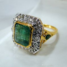 Emerald Ring, vintage 18K solid gold hallmarked Natural Emerald Diamond gemstone ring. Beautiful collection piece in very good condition. USA ring size -7.5 ( we can adjust size), size of top-18/18 mm, 18 K gold weight-8 grams, emerald weight-5.19 carat, diamond weight- 0.94 carat VS G. Will supply with a certificate. Classic Gold Square Cut Emerald Ring, Gold Emerald Cut Hallmarked Emerald Ring, Rectangular Stone Ring Hallmarked For Anniversary, Hallmarked Rings With Rectangular Stone For Anniversary, Vintage Emerald Cut Gemstone Cluster Ring, Vintage Emerald Cut Cluster Ring With Gemstone, Rectangular Stone Hallmarked Rings For Anniversary, Formal Rectangular Hallmarked Emerald Ring, Antique Gold Rings With Emerald