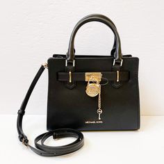 New With Tag Michael Kors Hamilton Small Satchel Shoulder Crossbody Bag Pebbled Leather Black 100% Authentic Retail: $368.00 Plus Tax ***Please See The Measurement For The Size*** No Dust Bag Michael Kors Logo At Front Zip Top Closure Gold Toned Hardware Mk Key & Lock On Front Custom Mk Fabric Lining 1 Slip-In Pockets 1 Zipper Pocket 10" (L) X 8"(H) X 4"(D) Strap: 4", 18"- 24" Very Clean, Smoke-Free And Pet-Free Environment. Black Satchel With Turn-lock Closure, Black Satchel With Turn-lock Closure For Evening, Black Evening Satchel With Turn-lock Closure, Black Evening Bag With Turn-lock Closure, Chic Black Satchel With Turn-lock Closure, Black Travel Bag With Turn-lock Closure, Michael Kors Bag With Turn-lock Closure, Luxury Michael Kors Bag With Turn-lock Closure, Chic Michael Kors Bag With Metal Hardware