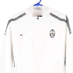 Description:Vintage Age 18 Juventus white Nike track jacket, fits x-large.GENDER: boys CONDITION: good - logo fading on front.STYLE: track jacketERA: 1990sCOLOUR: whiteFABRIC: polyester White Track Jacket With Three Stripes For Sports Season, White Throwback Outerwear For Winter, White Track Jacket For Winter Sports Events, White Winter Track Jacket For Sports Events, White Long Sleeve Track Jacket For Sports Season, White Outerwear For Sports Events And Season, White Hooded Outerwear For Sports Events, White Throwback Winter Outerwear, White Sporty Track Jacket For Streetwear