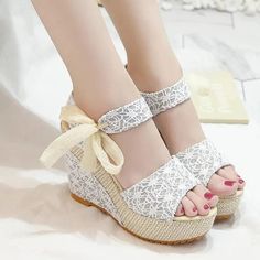 Women can enjoy a stylish and comfortable summer with these Bohemia Platform Bowknot Ankle Strap Casual Shoes. Featuring an open toe and high heel, these sandals are perfect for adding a touch of glamour to any outfit. Heel Height: Super High (8cm-up) Platform Height: 3-5cm These fashionable and stylish sandals will be the perfect touch to your casual wardrobe. Crafted from high-quality materials, including cotton fabric, PU lining, and rubber outsole, these sandals feature a unique butterfly-kn Elegant Synthetic Lace-up Sandals For Summer, White High Heel Wedge Sandals For Summer, White Eva Wedge Sandals For Summer, Summer Beach Lace-up Wedge Sandals, White Summer Wedge Sandals, Summer Open Toe Heels With Eva, Beige Open Toe Heels For Summer, Spring Open Toe Wedge Sandals, Summer Vacation Lace-up Sandals With Open Heel