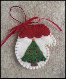 a felt ornament with a christmas tree on it