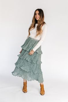 Empire State Ruffle Skirt – GabyVer Fall Tiered Ruffled Skirt, Tiered Layered Hem Bottoms, Tiered Bottoms With Layered Hem And Flowy Fit, Spring Tiered Voluminous Skirt, Tiered Maxi Skirt With Elastic Waistband, Spring Tiered Layered Maxi Skirt, Tiered Maxi Skirt For Layering, Casual Tiered Ruffle Maxi Skirt, Casual Tiered Maxi Skirt With Ruffles