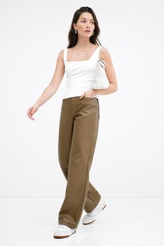 A force of nature in stretchy faux leather with a high-sheen finish, our Julien Pants offer a luxe feel to any look. Perfect for year-round wear, we've designed Julien with a wide-leg, high-rise cut and a distinctive horizontal seam at the knees. She'll elevate wherever and whenever you wear her. Also available in latte.[SPLIT] Rocio is 5'9.5" (175 cm) tall, wearing size XS. Total length from below the waist is approximately 42.5" (108 cm). Inseam length is approximately 33" (84 cm). Vegan Leath Sleek Wide Leg Leather Pants For Spring, Faux Leather Wide Leg Pants For Work, Trendy Wide-leg Leather Pants, Chic Wide Leg Faux Leather Pants, Chic Leather Wide Leg Pants, Chic Wide-leg Faux Leather Pants, Chic Faux Leather Wide-leg Pants, Spring Wide-leg Faux Leather Pants, Faux Leather Wide-leg Pants For Spring