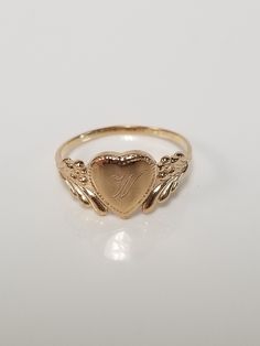 "Thanks for shopping our vintage estate store. We tend to sell well below wholesale and truly hope you enjoy all of our items. Many of the items are one of a kind, so please enjoy scrolling through the pictures and hopefully something will catch your eye. Brown spots are from camera or reflections. Estate 14k yellow gold monogram cursive capital W heart ring. Custom made ring for our shop. Ring size: 3 Setting: 7.5mm 1/4\" to 3/8\" Band width: 1.4mm Weight: 1.06 gram Marked 14k and it's sweet. O Vintage Gold Initial Ring Stamped 14k, Victorian 14k Gold Jewelry With Hallmark, Victorian Jewelry In 14k Gold With Hallmark, Classic Oval Heart Ring For Valentine's Day, Victorian 14k Gold Jewelry For Valentine's Day, Classic Heart-shaped 14k Gold Signet Ring, Classic Heart Shaped 14k Gold Signet Ring, Vintage White Gold Signet Ring Stamped 14k, Classic 14k Gold Heart-shaped Signet Ring