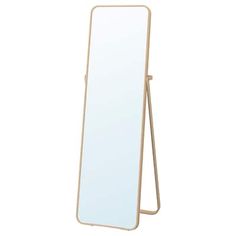 a mirror that is standing up on a stand