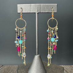 Intricate and elegant with vibrant tones and lots of movement, these fun dangle earrings with various shapes in beading, hand wire-wrapped and very lightweight. Approximately 3.5" Length Surgical steel dipped ear wires Dream Catcher Earrings, Aquamarine Beads, Halo Earrings Studs, Sell Gold, Silver Earrings Studs, Flower Earrings, Ring Bracelet, Ear Wires, Sales Gifts