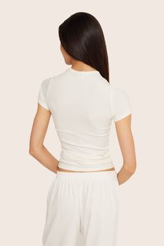 Discover sleek style with the Ribbed Modal Body Tee in Blanc. This full-length short sleeve fitted t-shirt features binding around the neckline, crafted from luxurious ribbed modal fabric. Modal Fabric, Skirt Jumpsuit, Sleek Style, Swim Shop, Short Leggings, Sleek Fashion, Swim Bottoms, Sweaters Knitwear, Bike Shorts