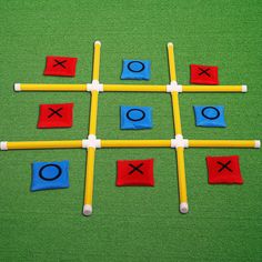 the tic - tac - toe game is made out of plastic sticks