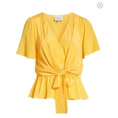 -16 1/2" Length -Front Tie Closure -Surplice V-Neck -Short Sleeves -Ties In Front -100% Viscose Vibrant Yellow Hue Perfect For Summer!! Elegant Yellow V-neck Top, Elegant Yellow Tops For Summer, Elegant Yellow Summer Tops, Chic Mustard Tops For Spring, Yellow V-neck Tops For Work, Chic Yellow Blouse For Day Out, Yellow V-neck Blouse For Spring, Gold V-neck Summer Blouse, Chic Mustard Short Sleeve Top