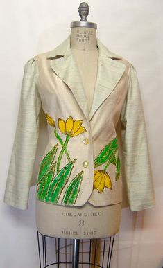 "Hand Made, hand beaded, and hand painted women's blazer, measurements are: Bust, 35; waist, 26; hip, 36; jacket length is 26\" long. Puff sleeve, 24\" long.  Hand made by the designer.  2 buttons in front, one of a kind garment but I can make different sizes to order.  Fully lined inside. Dry clean only." Spring Tailored Embroidered Blazer, Spring Tailored Blazer With Embroidery, Spring Embroidered Tailored Blazer, Spring Embroidered Fitted Blazer, Fitted Embroidered Blazer For Workwear, Embroidered Fitted Blazer For Workwear, Fitted Silk Blazer For Spring, Spring Silk Fitted Blazer, Spring Silk Fitted Outerwear