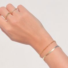 *Buy 2 items, Get 15% OFF your order. Coupon applied at checkout.* A luxurious gold herringbone snake bracelet makes for the perfect stand alone statement piece. Layer with your other favorite bracelets or pair with our herringbone necklace! - Chain width: 3 mm. - Adjustable chain 6 to 7.5 in. - Made in gold vermeil: a thick 18k gold layer on 925 sterling silver - 2 Year warranty GIFT WRAP AVAILABLE TO PURCHASE: https://www.etsy.com/listing/902780367/gift-wrap-for-gift-jewelry-pouch-jewelry?ref= Gold Minimalist Jubilee Chain Bracelet, Adjustable Rose Gold Bracelet With Gold Chain, Everyday Double Band Gold Jewelry, Minimalist Rose Gold Bracelet With Gold Chain, Double Band Jewelry With Adjustable Chain For Gifts, Fine Jewelry Chain Link Bracelet Gift, Dainty Metal Bracelets With Gold Chain, Minimalist Gold Bangle Bracelet With Adjustable Chain, Dainty Stackable Bangle Chain Bracelet