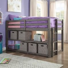 a bunk bed with purple walls and drawers