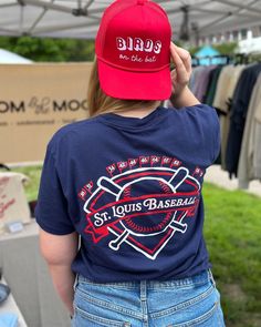 This Go Crazy Folks design is inspired by Buck's iconic call during the 1985 World Series. This design is hand drawn by me and screen printed on an extra soft, garment washed navy Comfort Colors St. Louis Baseball tee. The back features the years of all 11 of the Cardinals' World Series wins! Get the perfect gift for your favorite Saint Louis Baseball fan with vintage style baseball tee. This heavyweight, garment washed tee is 100% cotton and so comfortable. Fit: These tees are true unisex sizing. See size chart in last photo for unisex sizing. Material: 100% ring spun cotton Note: These are professionally screen printed in Saint Louis, Missouri. You are supporting two local businesses with a single purchase! Caring for your printed shirt: Wash inside out in cold water and with like colors Casual T-shirt With Screen Print For Fan Gatherings, Navy Screen Print Top For Fan Merchandise, Screen Print Crew Neck Tops For Fan Gatherings, Blue Tops With Screen Print For Baseball Season, Navy Tops With Letter Print For Baseball Season, Cotton Letter Print T-shirt For Fan Gatherings, Casual Screen Print T-shirt For Fan Gatherings, Navy Letter Print Tops For Baseball Season, Cotton Fan Apparel T-shirt For Gatherings