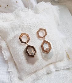 "Statement hexagon drop, dangle earrings in 925 sterling silver with some geometric pendant in Rose gold plating over the 925 silver. It has a small clear zircon which brings light.  > Metal: Sterling silver and sterling silver rose gold plated > Pendant size: 4,5 cm / 1,77\"inches  x 1,8 cm/ 0,70\"inches > Stone: 3 mm / 0,11\"inches Clear Zirconium As you can see the sterling silver plated rose cold is shinny and the parts remaining in sterling silver are matt silver in order to create more con Elegant Silver Geometric Earrings, Elegant Geometric Earrings As Gift, Elegant Geometric Earrings For Gifts, Modern Rose Gold Dangle Earrings, Elegant Geometric White Jewelry, Elegant White Hexagon Jewelry, Elegant White Geometric Jewelry, Elegant Hexagon Earrings For Gift, Modern Rose Gold Drop Earrings