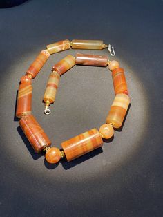 A beautiful carnelian agate beads necklace Antique carnelian agate beads made in Germany Idar Oberstein in the late 1800's They were used as trade item in African trade in late 1800's some gold color brass beads are used as counter beads we provide fast and free shipping by which can get the items by maximum 7 working days Carnelian Oval Beads Necklaces For Healing, Carnelian Healing Necklace With Oval Beads, Vintage Carnelian Beaded Necklaces With Natural Stones, Antique Agate Beaded Necklace As Gift, Vintage Agate Gemstone Beaded Necklaces, Antique Agate Beaded Necklaces With Natural Stones, Antique Carnelian Necklaces With Natural Stones, Antique Agate Beaded Necklace With Natural Stones, Antique Carnelian Necklace With Natural Stones