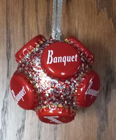 an ornament hanging on a wooden table that says banquet