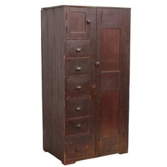 an old wooden armoire with drawers on the front and bottom doors, isolated against a white background