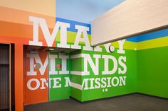 the inside of a building with multi colored walls and doors that say, may millds one mission