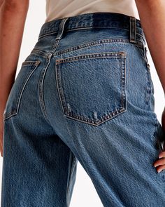 Step into the nostalgia of the early 2000s with Abercrombie & Fitch's Women's High Rise Loose Jeans. These jeans are a modern twist on a classic style, perfect for those who value both comfort and fashion.

- Size: 30 X-SHORT
- Color: Dark with Raw Hem
- Material: Body - Cotton, Lyocell; Pocket Bag - Various materials
- Gender: Female
- Fit: High rise (10.5” rise), relaxed at the waist and hips, loose full-length leg
- Features: Lightweight rigid denim, super soft authentic cotton fabric with no Everyday Medium Wash Cutoff Flare Jeans, Dark Wash Cutoff Flare Jeans For Everyday, Dark Wash Cotton Cropped Cutoff Jeans, Dark Wash Cotton Cutoff Cropped Jeans, Classic High Rise Jeans With Frayed Hem, Distressed Dark Wash Cropped Jeans In Rigid Denim, Everyday Cutoff Flare Jeans With Frayed Hem, Everyday Medium Wash Cutoff Cropped Jeans, Classic Cutoff Denim Jeans