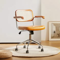 an office chair sitting on top of a white rug