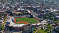 an aerial view of a baseball field in the city