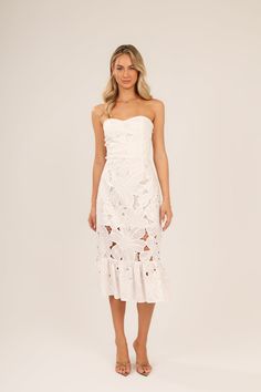 Product Description: Turn heads in this stunning strapless ruffle dress, featuring a flirty sweetheart neckline and a chic, body-skimming silhouette. Gripper tape along the top edge ensures a secure fit, while a smocked panel across the bodice adds adjustability for a perfect, comfortable feel. The elegant ruffle detailing brings a playful touch, making this dress a must-have for any special occasion. Made in Turkey Dry clean only Cotton Poly blend Lined Based on a size small: Size Small= 41 1/4 Marriage Manifestation, Strapless Ruffle Dress, British Indian, Nordstrom Dresses, Ruffle Dress, Sweetheart Neckline, Floral Dress, Bodice, Special Occasion