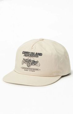 a white hat with an old car on the front, and black lettering on the side