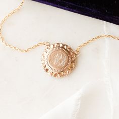 This one-of-a-kind necklace is composed of: Victorian medallion from the late 1800s with the initials "GLB" hand-engraved in the center. This necklace measures a standard 18” on a modern 14k gold filled chain, with the pendant measuring 0.875" in height. Luxury Yellow Gold Necklace With Vintage Charm, Elegant Engraved Initial Pendant Medallion Necklace, Elegant Vintage Charm Coin Necklace As Gift, Victorian Style Medallion Coin Pendant Jewelry, Elegant Vintage Charm Coin Necklace Gift, Elegant Vintage Charm Coin Necklace For Gift, Elegant Vintage Coin Necklace As Gift, Brass Medallion Jewelry For Commemoration, Personalized Brass Medallion Necklaces