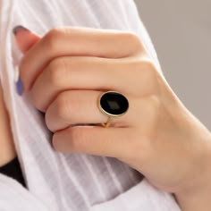 "\"Vintage Black Onyx Ring - Exquisite Black Onyx Ring\" Elevate your style with this extraordinary Black Onyx ring, designed to captivate and leave a lasting impression. Crafted with precision, this statement piece showcases a genuine Black Onyx gemstone, renowned for its deep, mysterious allure. Key Features: - Genuine Black Onyx: This ring features a stunning, high-quality Black Onyx stone that exudes elegance and sophistication. - Unique Design: Our expert artisans have meticulously crafted Classic Black Crystal Ring, Modern Black Cabochon Rings, Black Oval Enamel Ring For Anniversary, Vintage Black Round Rings, Vintage Onyx Black Rings, Round Onyx Cabochon Rings, Onyx Cabochon Rings, Classic Black Enamel Ring, Onyx Cabochon Round Rings