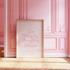 a pink room with a white framed sign on the floor and pink wall behind it that says, i'm taking my everything shower