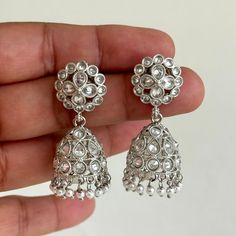 Small Light weight silver Polki Jhumka/stone Jhumka/Indian Jewelry/Pakistani/Punjabi/Indian/Statement earring/Bridal earring/Indian wedding Height = 44 mm || Width = 18 mm Jhumki Antique Earring It can be paired with any dress Closure: Pushback This is 100% Handmade jewelry. So Color, shades, and texture displayed may vary slightly from the actual product due to digital image limitations. We request you to consider these minor variations. Please expect the possibility of some slight imperfections when buying hand made jewelry. If you have any questions, please message or email us. Arrives in gift box. Please let me know if you have any questions. Thank you so much visiting my shop. Festive Silver Chandelier Earrings With Tilla, Silver Chandelier Earrings With Tilla For Gifts, Elegant Silver Danglers For Navratri, Traditional Silver Chandelier Earrings For Festive Occasions, Silver Chandbali Chandelier Earrings With Stone Work, Silver Metal Chandbalis For Wedding, Elegant Silver Metal Jhumkas, Silver Chandelier Earrings With Intricate Design For Festive Occasions, Wedding Silver Chandbalis With Intricate Design