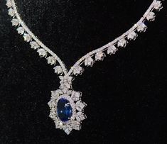 "$68,499 investment grade estate 18k solid gold 26.89cts diamond and tanzanite necklace !!the earrings are listed in another listing!! gorgeous f-g color and vs clarity untreated natural diamonds and 100% natural huge tanzanite. extremely high end - top quality necklace description: this is a custom made top quality rare tanzanite and diamond necklace. the necklace features a huge investment grade 13.03cts tanzanite in center surrounded with 13.86cts of brilliant cut natural diamonds. the tanzan Gia Certified Luxury Necklace For Formal Occasions, Luxury Gia Certified Necklaces For Formal Occasions, Gia Certified Luxury Formal Necklace, Gia Certified Fine Jewelry Necklaces For Formal Occasions, Exquisite Gia Certified Necklace For Formal Occasions, Luxury Tanzanite Necklace With Brilliant Cut, Luxury Tanzanite Necklace For Anniversary, Luxury Tanzanite Necklaces For Anniversary, Luxury Gia Certified Diamond Necklace For Formal Occasions