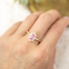 This is made to order ring. Beautiful unheated pink sapphire from Madagascar, weight ranges from 0.60 to 0.7ct, 7x5mm, eye clean 0.08ctw., G color SI clarity accent diamonds Band width: approx. 1.9mm High profile setting, easy stacking with a straight band Made of recycled solid 14k gold Our Dedication All our jewelry is designed and created by Kat with great attention to details and the entire production from casting, stone setting to finishing takes place in New York, USA. All gemstones used i Pink Sapphire Promise Ring With Halo Setting, Pink Sapphire Promise Ring With Halo Design, Pink Diamond Ring With Emerald Cut And Halo Setting, Pink Diamond Halo Promise Ring, Pink Emerald Cut Diamond Ring With Halo Setting, Pink Emerald-cut Diamond Ring With Halo Setting, Pink Diamond Halo Ring With Prong Setting, Pink Sapphire Ring With Halo Design For Anniversary, Pink Emerald Cut Rings With Halo Setting