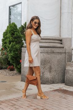 Expertly crafted for comfort and style, our Oatmeal Pleated Linen Mini Dress is a must-have for any wardrobe! Made from a luxurious blend of 70% viscose and 30% linen, this dress features a pleated bust for a flattering fit, adjustable straps, and a back zip closure. With the added convenience of side pockets and a shorts lining, it's the perfect dress for any occasion! Style with strappy sandals, elevated gold jewelry, and a simple clutch for everyday wear. Linen Midi Dress For Daytime In Spring, Casual Beige Linen Day Out Dress, Casual Beige Linen Dress For Day Out, Casual Neutral Linen Midi Dress, Linen Mini Dress For Brunch, Casual Linen Dress For Brunch, Elegant Flax Linen Spring Dress, Neutral Linen Midi Dress For Vacation, Daytime Linen Midi Dress