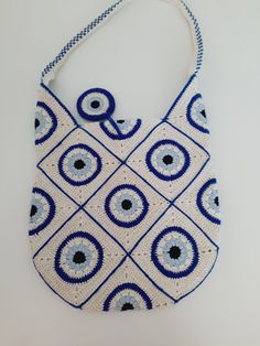 Hello. I produce these products for you in Turkey. I'm very new here. Your support is very valuable to me. The handmade evil eye bead patterned bag is a stylish bag with a spacious interior, a top that closes with a magnetic snap, an interior pocket, and an evil eye ornament on the front.🧿It is the perfect accessory for shopping, picnics in the park, trips to the beach and much more. Cotton rope summer bag, crocheted shoulder bag, shoulder bag, cotton rope evil eye bag, handmade bag, beach bag, Moon Crochet Bag, Evil Eye Crochet Top, Evil Eye Crochet Bag, Summer Bags Crochet, Eco-friendly Crochet Shoulder Bag With Adjustable Strap, Evil Eye Bag, Eco-friendly Blue Crochet Bag, Eye Ornament, Bad Energy