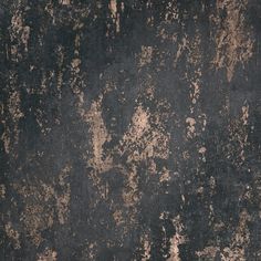 an old black and brown wall with peeling paint