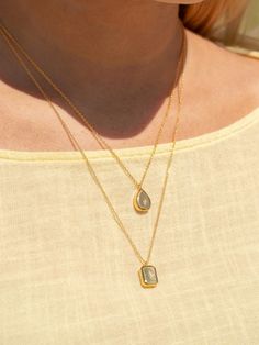 Teardrop necklaces are globally known for their classic and chic look. Our Sol Teardrop necklace helps give a striking display. Emblazoned with gold plating, the fine detailing of our necklace contrasts with glimpses of skin beneath. This memorial teardrop pendant is a fitting tribute to cherished moments you wish to keep close.Available in White gold and Yellow gold colors. - Gold plating over brass- Rhodium plating over brass Iris Necklace, Golden Necklace, Gold Colors, Teardrop Necklace, Teardrop Pendant, Chic Look, Chain Lengths, Gold Plating, Rhodium Plated