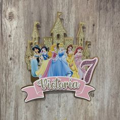 there is a wooden wall that has some princesses on it and the number seven