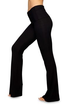 These soft, stretchy ribbed pants with a foldover waistband and flared legs are from Kim Kardashian West's sought-after SKIMS. 33 1/2" inseam; 21 1/2" leg opening; 9" front rise; 12 1/2" back rise (size Medium) 91% modal, 9% spandex Machine wash, dry flat Imported Fold Over Pants, Ribbed Pants, Flare Leg Pants, Fold Over, Shop Dresses, Kim Kardashian, Leg Pants, Rib Knit, Onyx