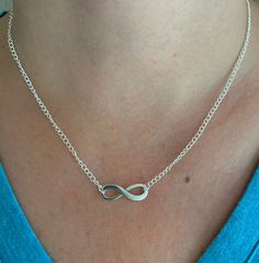 This is a simple yet beautiful infinity pendant necklace. The minimalist design is very versatile and may be worn with a variety of outfits. The infinity pendant symbolises everlasting love making it the perfect and special gift for an anniversary gift or valentines gift for that someone special.  The necklace is made with an elegant silver plated fine curb chain. In the centre of the chain there is a beautiful Tibetan silver infinity pendant which is 2.5 cm in length.  The necklace fastens by way of a lobster clasp and ring. The necklace exists in a variety of lengths. Longer lengths are not available in this design of necklace.  Lead and Nickle free The necklace comes wrapped and packaged in a gift box making that special and thoughtful gift.  Care of your necklace It is advised to clean Trendy Infinity Jewelry, Trendy Infinity Jewelry Gift, Trendy Infinity Jewelry For Gift, Minimalist Infinity Clavicle Chain Necklace, Minimalist Infinity Necklace With Delicate Chain, Minimalist Infinity Necklace For Everyday, Adjustable Minimalist Infinity Necklace, Minimalist Adjustable Infinity Necklace, Belly Conklin